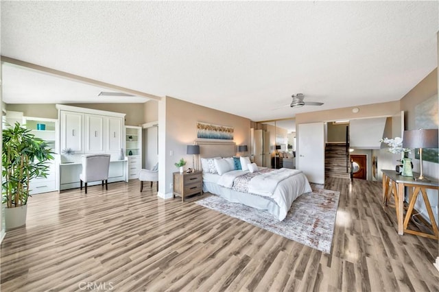 15 Vista Del Ponto Unit 70, San Clemente, CA 92672 - bedroom with wood finished floors and a textured ceiling