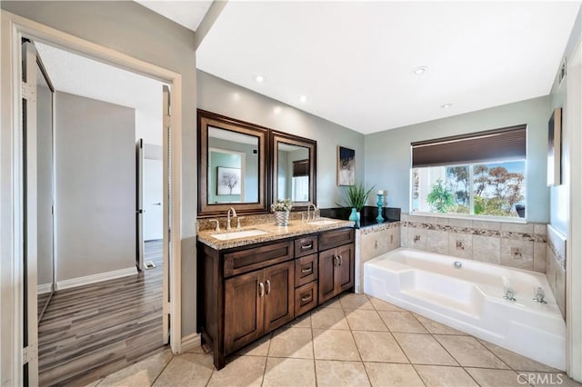 15 Vista Del Ponto Unit 70, San Clemente, CA 92672 - full bath featuring double vanity, a bath, and tile patterned flooring