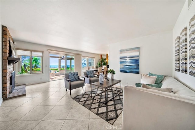 15 Vista Del Ponto Unit 70, San Clemente, CA 92672 - living room featuring light tile patterned floors and a brick fireplace