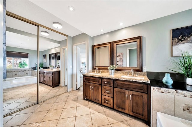 15 Vista Del Ponto Unit 70, San Clemente, CA 92672 - bathroom with double vanity, a garden tub, tile patterned floors, and recessed lighting