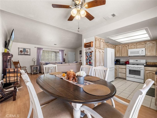 11671 Mountain Rd, Pinon Hills, CA 92372 - dining room featuring light wood-style flooring, lofted ceiling, and a ceiling fan