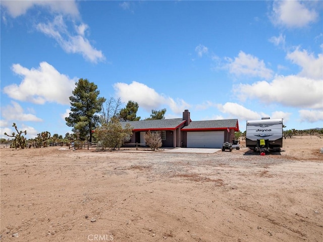 11671 Mountain Rd, Pinon Hills, CA 92372 - view of front of property with a garage and dirt driveway