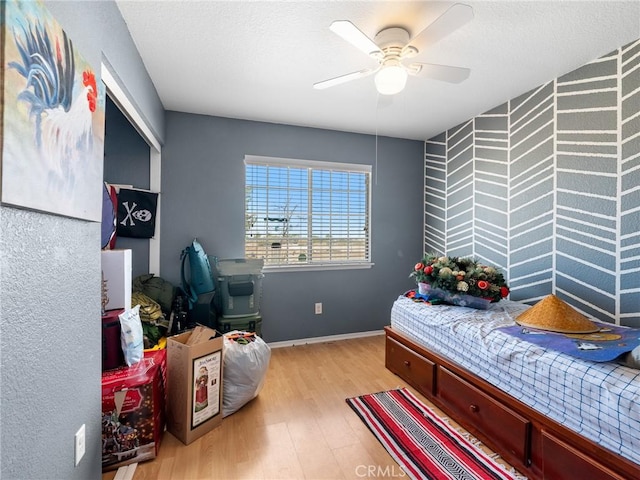 11671 Mountain Rd, Pinon Hills, CA 92372 - bedroom with light wood finished floors and ceiling fan