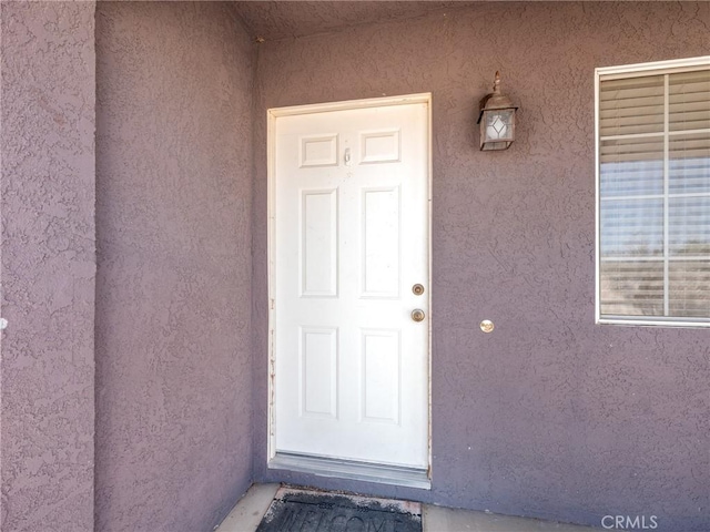 11671 Mountain Rd, Pinon Hills, CA 92372 - property entrance with stucco siding