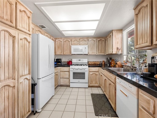 11671 Mountain Rd, Pinon Hills, CA 92372 - kitchen featuring white appliances, light brown cabinetry, light tile patterned flooring, and dark countertops