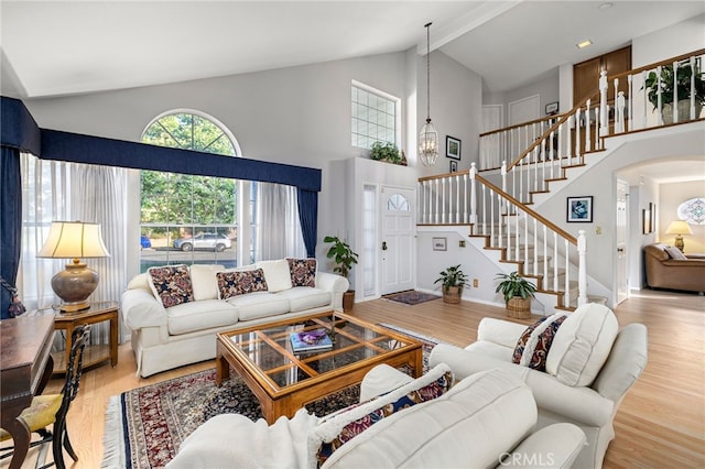 1997 Via Arroyo, La Verne, CA 91750 - living area with high vaulted ceiling, stairway, wood finished floors, a chandelier, and arched walkways