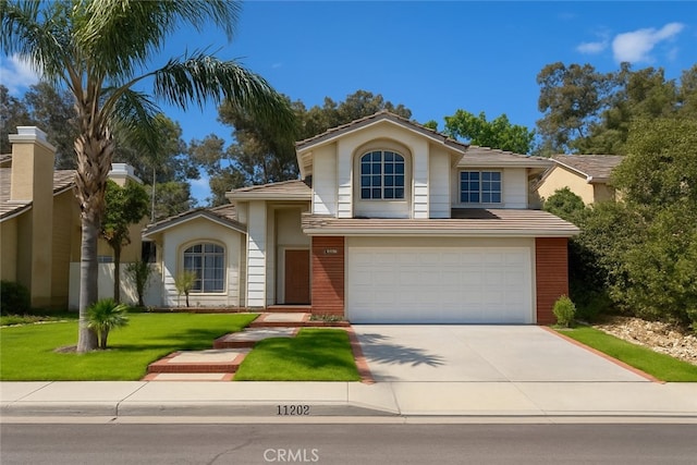 11268 Brown, Rancho Cucamonga, CA 91701 - view of front of property featuring driveway, a garage, a tiled roof, and a front lawn