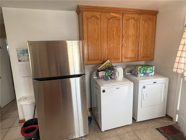 3528 E 54th St, Maywood, CA 90270 - laundry area with washing machine and dryer and light tile patterned flooring
