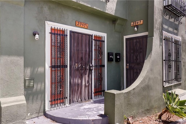 2945 W 11th St, Los Angeles, CA 90006 - doorway to property featuring a gate and stucco siding