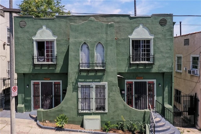 2945 W 11th St, Los Angeles, CA 90006 - rear view of house featuring a balcony and stucco siding