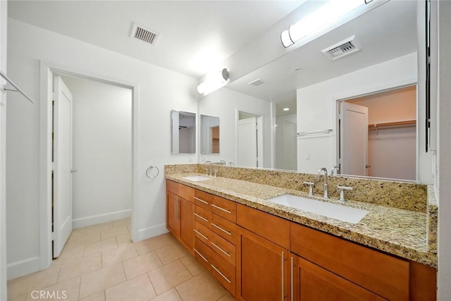 300 E 4th St Unit 118, Long Beach, CA 90802 - full bath with double vanity, tile patterned flooring, and a walk in closet