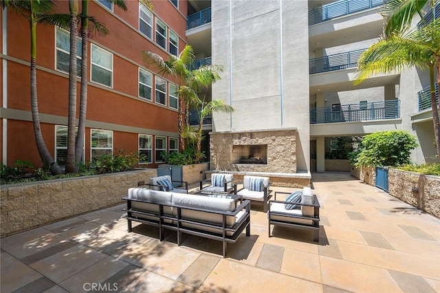 300 E 4th St Unit 118, Long Beach, CA 90802 - view of patio featuring an outdoor living space with a fireplace
