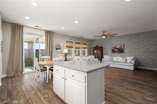 3455 Sugar Maple Ct, Hemet, CA 92545 - kitchen with wallpapered walls, ceiling fan, recessed lighting, dark wood finished floors, and a kitchen island