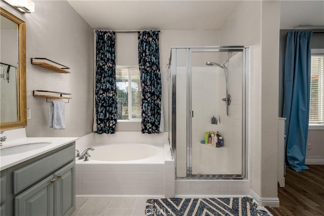 3455 Sugar Maple Ct, Hemet, CA 92545 - full bathroom featuring a bath, vanity, and a stall shower