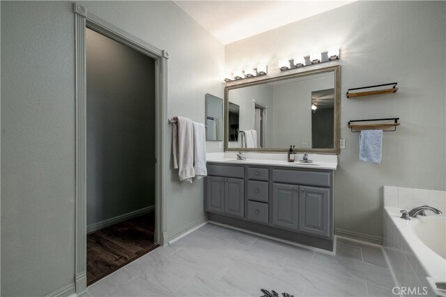 3455 Sugar Maple Ct, Hemet, CA 92545 - full bath with double vanity, a bath, and marble finish flooring