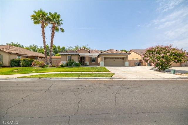 3455 Sugar Maple Ct, Hemet, CA 92545 - view of front facade featuring a tiled roof, an attached garage, stucco siding, driveway, and a front lawn