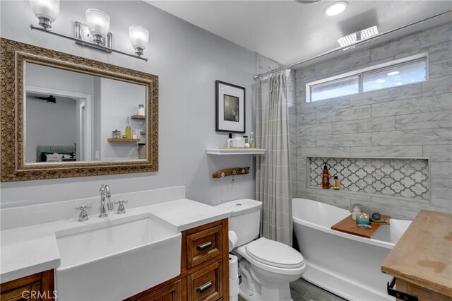 6320 Rancho Rio Rd, Paramount, CA 90723 - bathroom featuring vanity and toilet