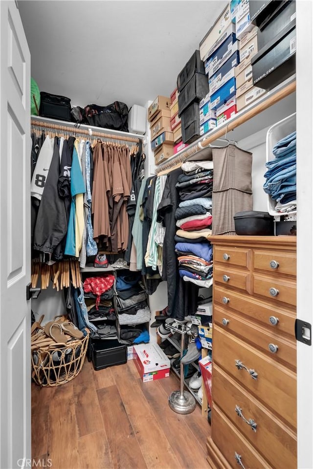 6320 Rancho Rio Rd, Paramount, CA 90723 - walk in closet featuring wood finished floors