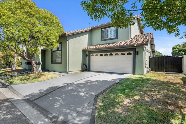 6320 Rancho Rio Rd, Paramount, CA 90723 - mediterranean / spanish home with a tile roof, concrete driveway, stucco siding, and an attached garage