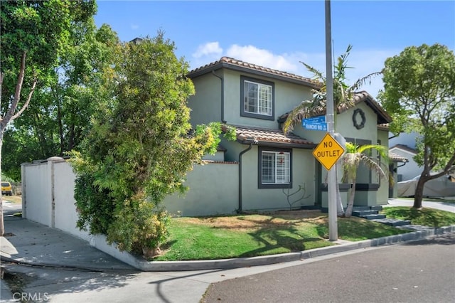 6320 Rancho Rio Rd, Paramount, CA 90723 - mediterranean / spanish home with a tiled roof and stucco siding