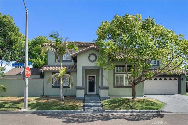 6320 Rancho Rio Rd, Paramount, CA 90723 - mediterranean / spanish-style home with concrete driveway, a tile roof, and stucco siding