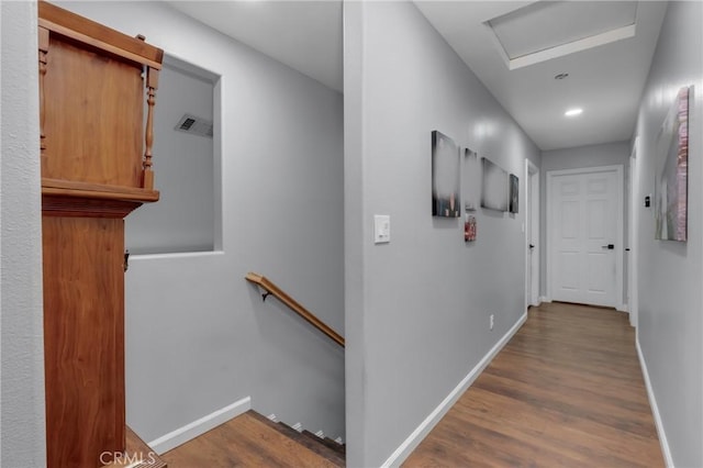 6320 Rancho Rio Rd, Paramount, CA 90723 - corridor with an upstairs landing, wood finished floors, recessed lighting, and attic access