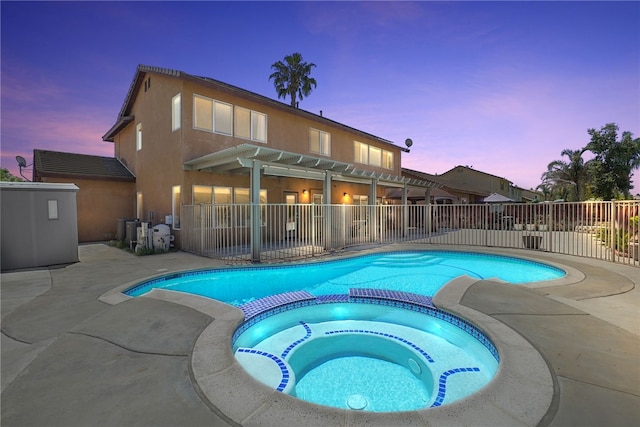 35887 Rhone Ln, Winchester, CA 92596 - pool at dusk with a pergola, a pool with connected hot tub, and a patio area