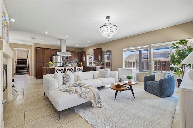 35887 Rhone Ln, Winchester, CA 92596 - living room with a chandelier, recessed lighting, light tile patterned floors, and stairs