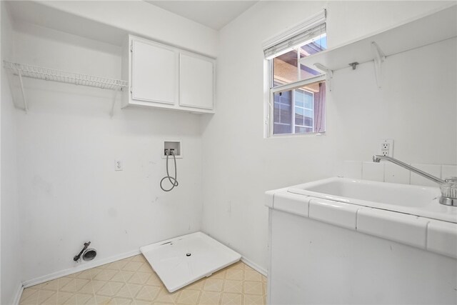 35887 Rhone Ln, Winchester, CA 92596 - laundry room with cabinet space, washer hookup, and light flooring