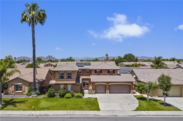 35887 Rhone Ln, Winchester, CA 92596 - view of front facade featuring a residential view, concrete driveway, stucco siding, a front yard, and solar panels