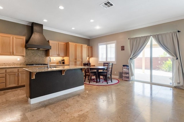 34214 Pinehurst Dr, Yucaipa, CA 92399 - kitchen featuring custom range hood, ornamental molding, light brown cabinets, recessed lighting, and tasteful backsplash