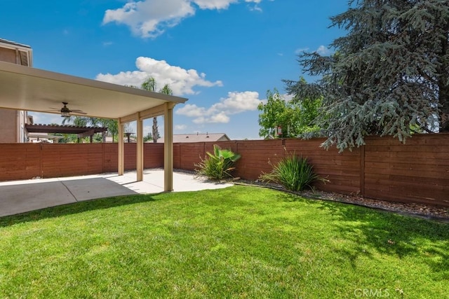 34214 Pinehurst Dr, Yucaipa, CA 92399 - fenced backyard featuring a ceiling fan and a patio