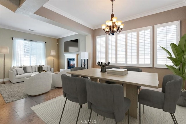 34214 Pinehurst Dr, Yucaipa, CA 92399 - dining space featuring a chandelier, crown molding, and a glass covered fireplace