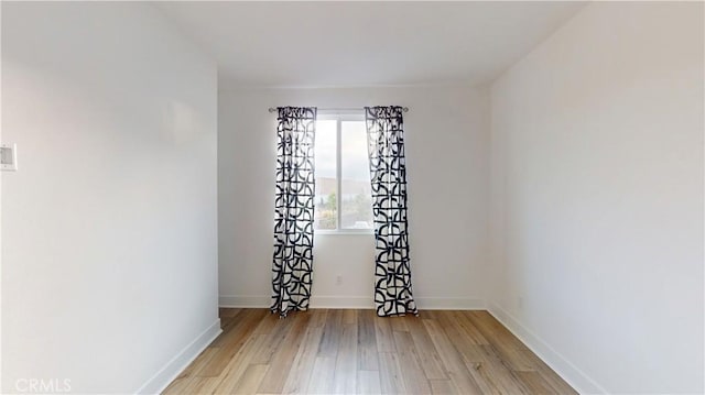 2750 W 182nd St Unit 112, Torrance, CA 90504 - spare room featuring wood finished floors and baseboards