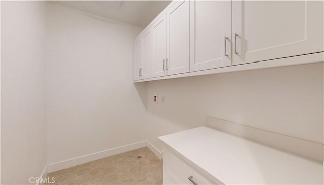 2750 W 182nd St Unit 112, Torrance, CA 90504 - laundry area with cabinet space and baseboards