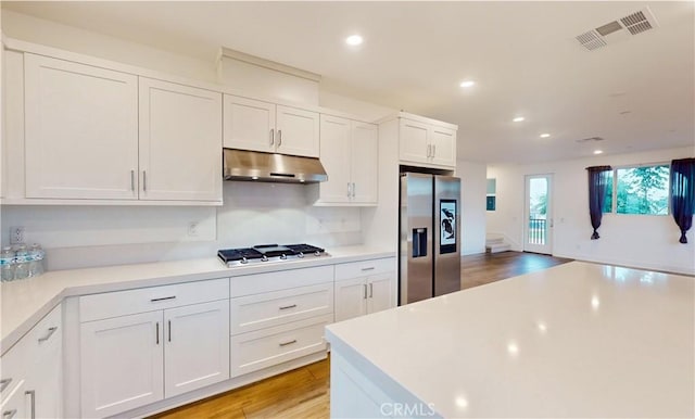 2750 W 182nd St Unit 112, Torrance, CA 90504 - kitchen featuring appliances with stainless steel finishes, under cabinet range hood, recessed lighting, light countertops, and white cabinetry