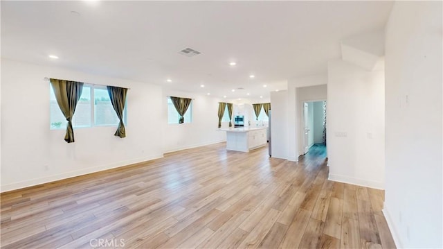 2750 W 182nd St Unit 112, Torrance, CA 90504 - unfurnished living room with light wood-style flooring and recessed lighting
