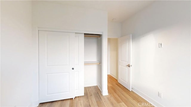 2750 W 182nd St Unit 112, Torrance, CA 90504 - unfurnished bedroom with light wood-style flooring and a closet