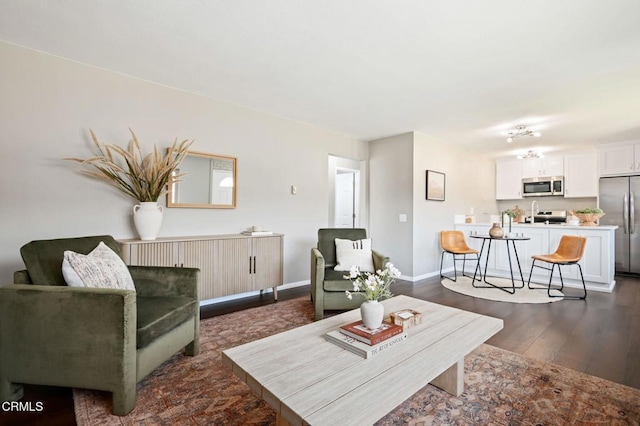5946 Hickory St Unit 1, Carpinteria, CA 93013 - living area featuring dark wood-style floors and baseboards