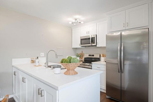 5946 Hickory St Unit 1, Carpinteria, CA 93013 - kitchen with appliances with stainless steel finishes, white cabinets, light countertops, and dark wood-style floors