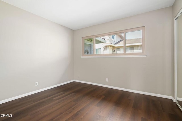5946 Hickory St Unit 1, Carpinteria, CA 93013 - unfurnished room featuring baseboards and dark wood-type flooring