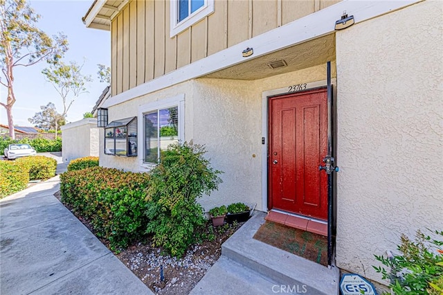 23763 Highland Valley Rd, Diamond Bar, CA 91765 - view of exterior entry with board and batten siding and stucco siding