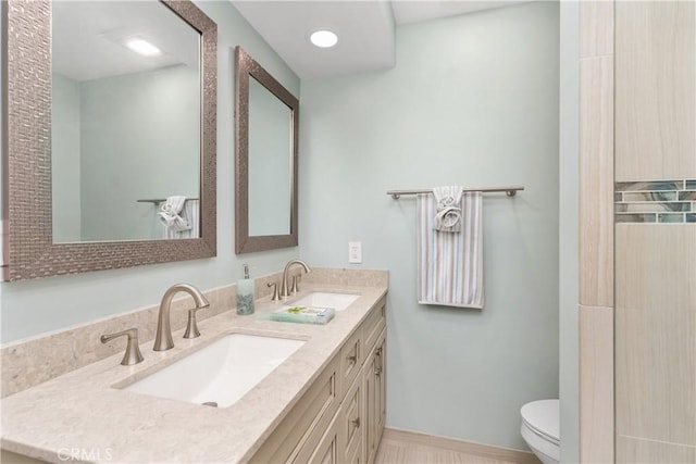 1837 N Studebaker Rd, Long Beach, CA 90815 - bathroom featuring double vanity and toilet