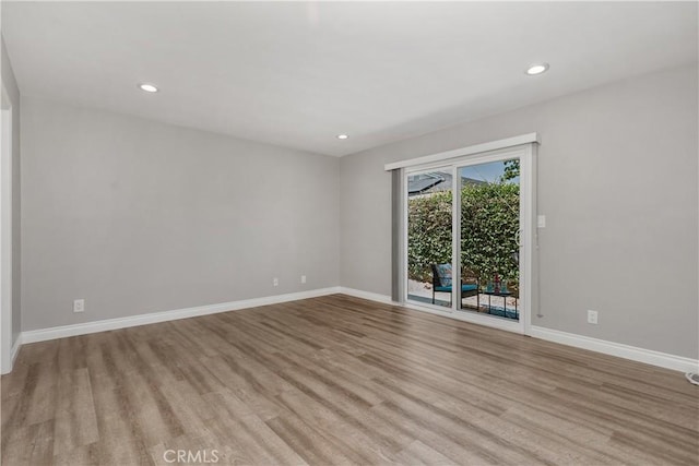 1837 N Studebaker Rd, Long Beach, CA 90815 - empty room featuring wood finished floors and recessed lighting