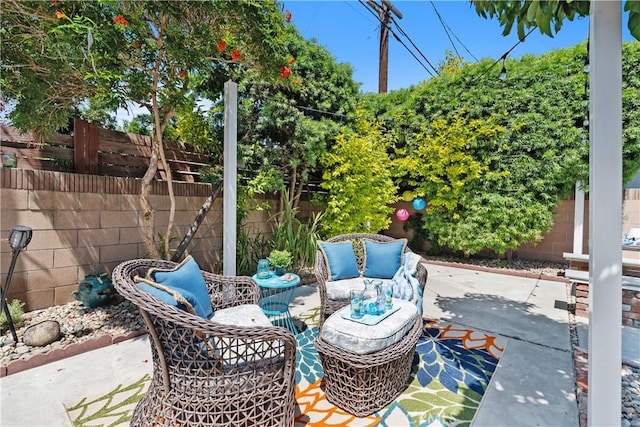 1837 N Studebaker Rd, Long Beach, CA 90815 - fenced backyard featuring an outdoor hangout area and a patio area
