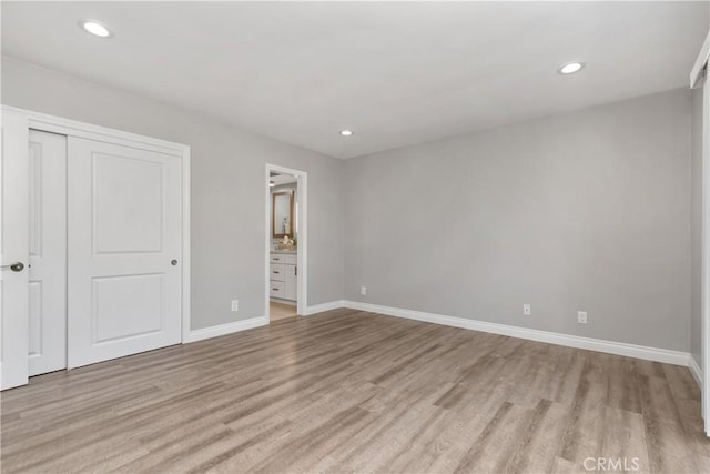 1837 N Studebaker Rd, Long Beach, CA 90815 - unfurnished bedroom featuring light wood-style floors, recessed lighting, a closet, and ensuite bath