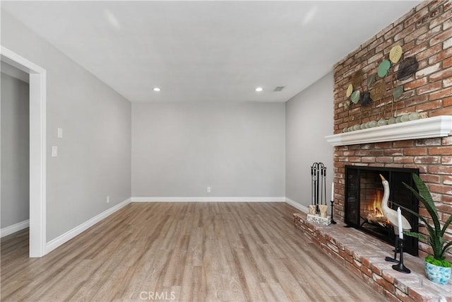 1837 N Studebaker Rd, Long Beach, CA 90815 - unfurnished living room featuring wood finished floors, a fireplace, and recessed lighting