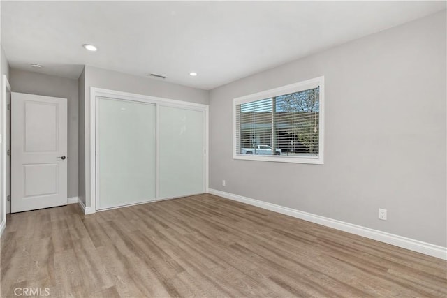 1837 N Studebaker Rd, Long Beach, CA 90815 - unfurnished bedroom featuring wood finished floors, a closet, and recessed lighting