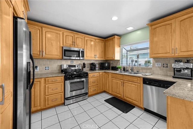 1320 Carob Way, Montebello, CA 90640 - kitchen with appliances with stainless steel finishes, decorative backsplash, light tile patterned floors, and light stone countertops