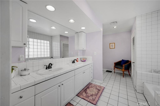 1320 Carob Way, Montebello, CA 90640 - full bathroom with double vanity, recessed lighting, a tub to relax in, and tile patterned floors